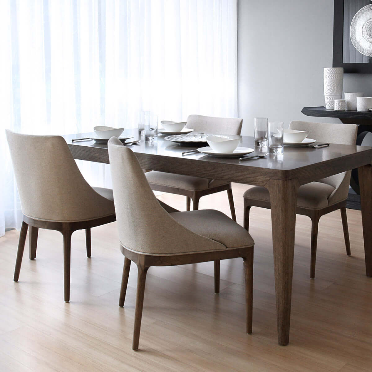 contemporary dining chair with straight wooden legs and a low backrest dining table view